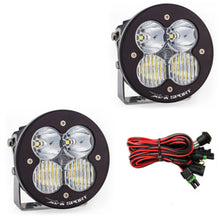 Load image into Gallery viewer, Baja Designs XL R Sport Series LED light pods with clear lenses, featuring a driving combo pattern and wiring harness.