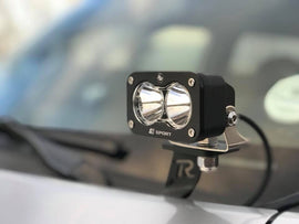 Baja Designs S2 Sport Pair Wide Cornering LED lights mounted on a vehicle, designed for enhanced visibility and offroad performance.