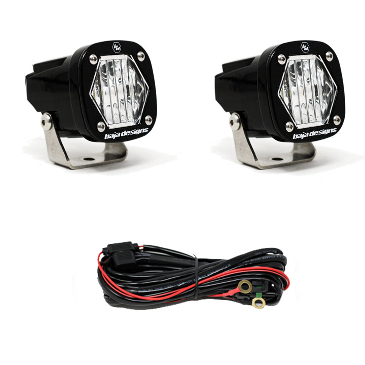 Baja Designs S1 Wide Cornering lens lights with mounting brackets and wiring harness for enhanced visibility.
