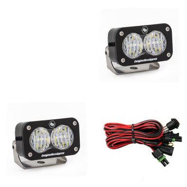 Baja Designs S2 Pro Pair Wide Cornering LED lights with mounting brackets and wiring harness for offroad vehicles.