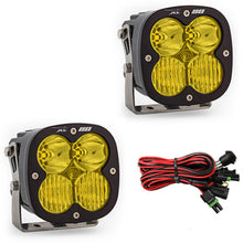 Load image into Gallery viewer, Baja Designs XL80 Series amber LED light pods with driving combo pattern, featuring a durable design and wiring harness.