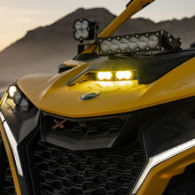 Load image into Gallery viewer, Baja Designs 2024+ Can-Am Maverick R S2 Pro Hood Light Kit mounted on a yellow UTV, enhancing off-road visibility.