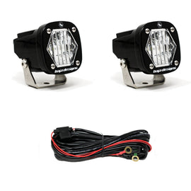 Baja Designs S1 Wide Cornering LED light pair with mounting brackets and wiring harness for enhanced off-road visibility.
