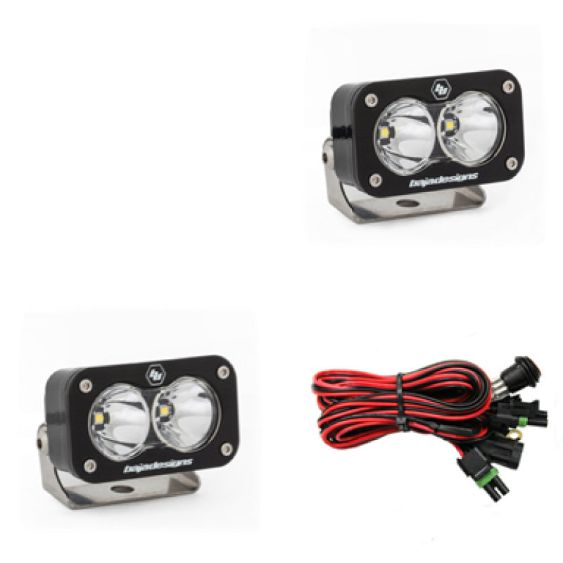 Baja Designs S2 Pro Series LED light pods in spot pattern, featuring a sleek design and wiring harness for installation.
