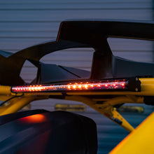 Load image into Gallery viewer, Baja Designs 2024+ Can-Am Maverick R RTL Kit featuring a sleek LED light bar mounted on the vehicle's frame.