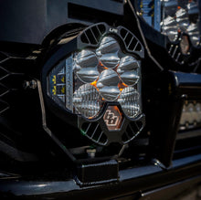 Load image into Gallery viewer, Baja Designs LP6 Pro amber spot light mounted on a vehicle, showcasing its powerful LED design and rugged build.