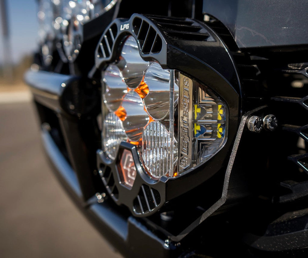 Baja Designs LP6 Pro amber spot light mounted on a vehicle, showcasing its sleek design and powerful illumination features.