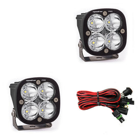 Baja Designs Squadron Pro LED cubes with four LEDs each, paired with wiring harness for offroad lighting solutions.