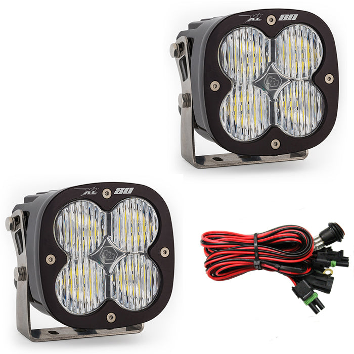 Baja Designs XL80 wide cornering lights pair with wiring harness for enhanced visibility and off-road performance.