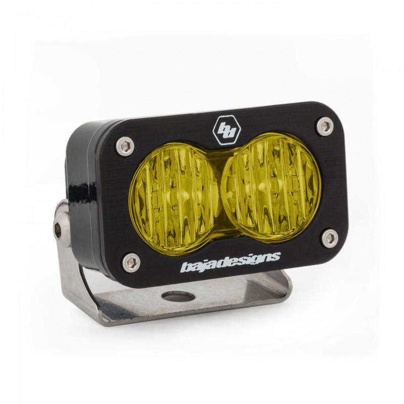 Baja Designs S2 Pro Wide Cornering Pattern LED light in amber, featuring a durable black housing and mounting bracket.