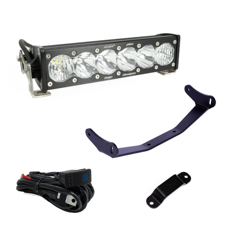 Baja Designs Can-Am Maverick R Clear 10in OnX6+ Shock Tower Kit with LED light bar and mounting hardware for offroad vehicles.