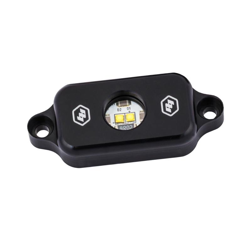 Baja Designs red LED rock light designed for offroad vehicles, featuring a durable housing and bright illumination.