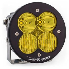 Baja Designs XL R Pro amber LED light pod with a round design, featuring two lenses and a sturdy mounting bracket.
