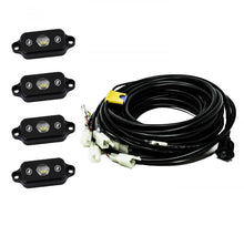 Load image into Gallery viewer, Baja Designs Universal White Rock Light Kit featuring four compact lights and wiring harness for offroad illumination.