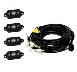 Baja Designs Universal White Rock Light Kit featuring four compact lights and wiring harness for offroad illumination.